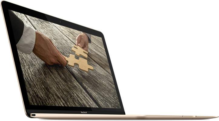 Schnittstellenentwicklung Symbolbild mit Puzzle auf Macbook